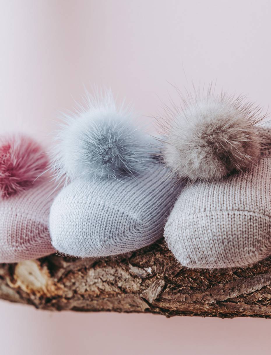 Wool baby booties with soft pom-pom 